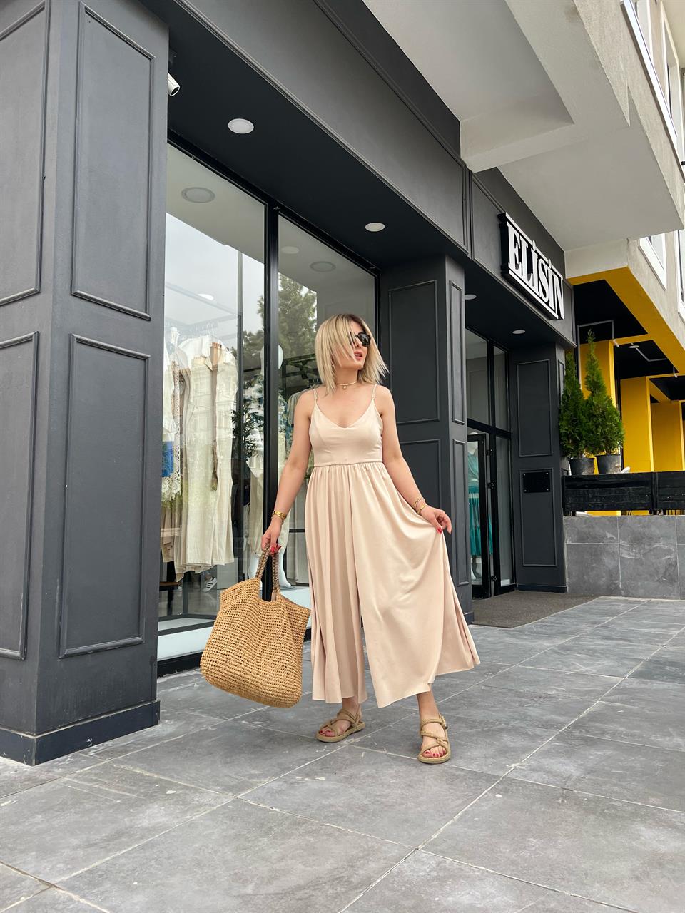 Beige Jumpsuit with Adjustable Straps and Wide Legs
