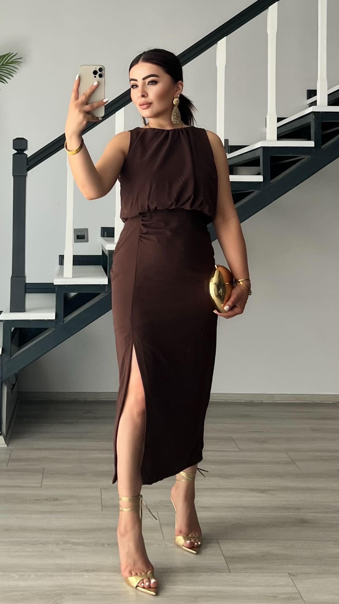 Coffee-colored dress with front slit and ruching.