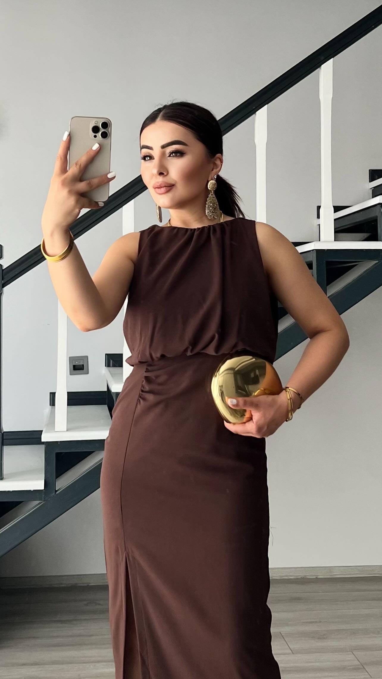 Coffee-colored dress with front slit and ruching.