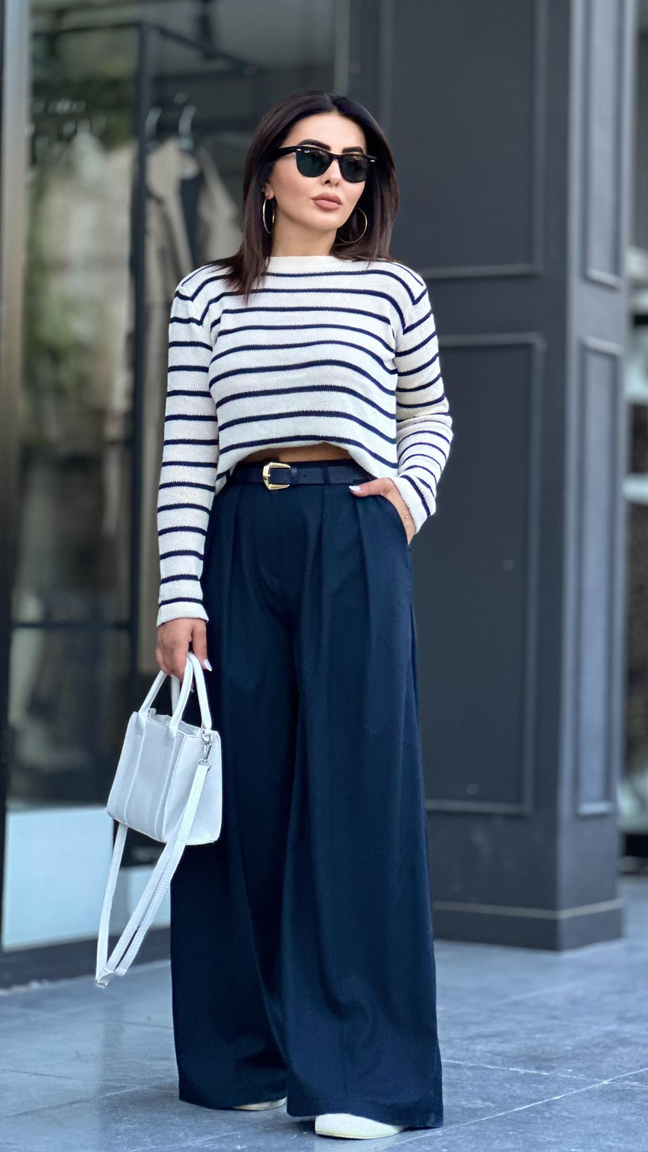 Navy pleated palazzo trousers with built-in belt.