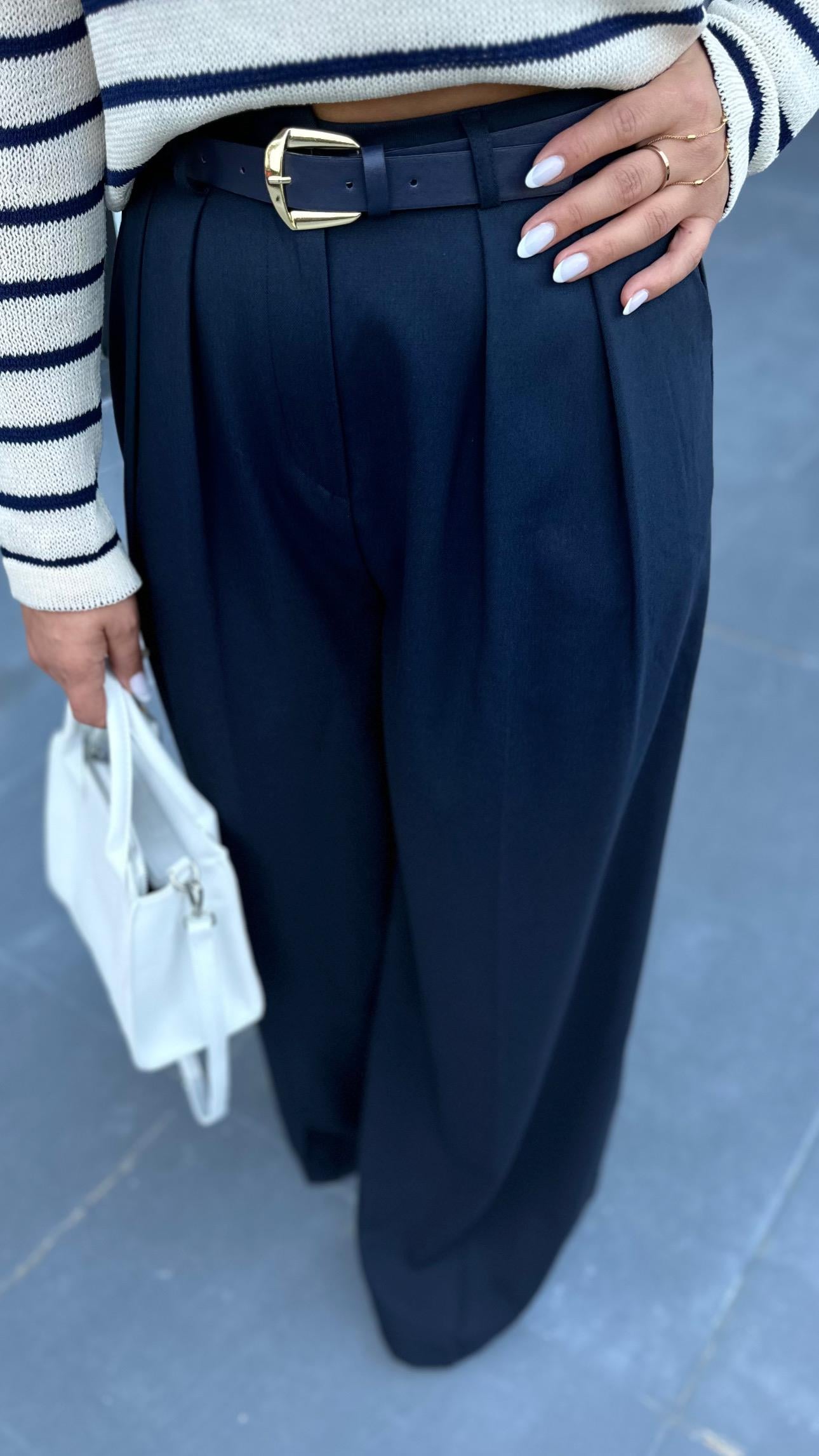 Navy pleated palazzo trousers with built-in belt.