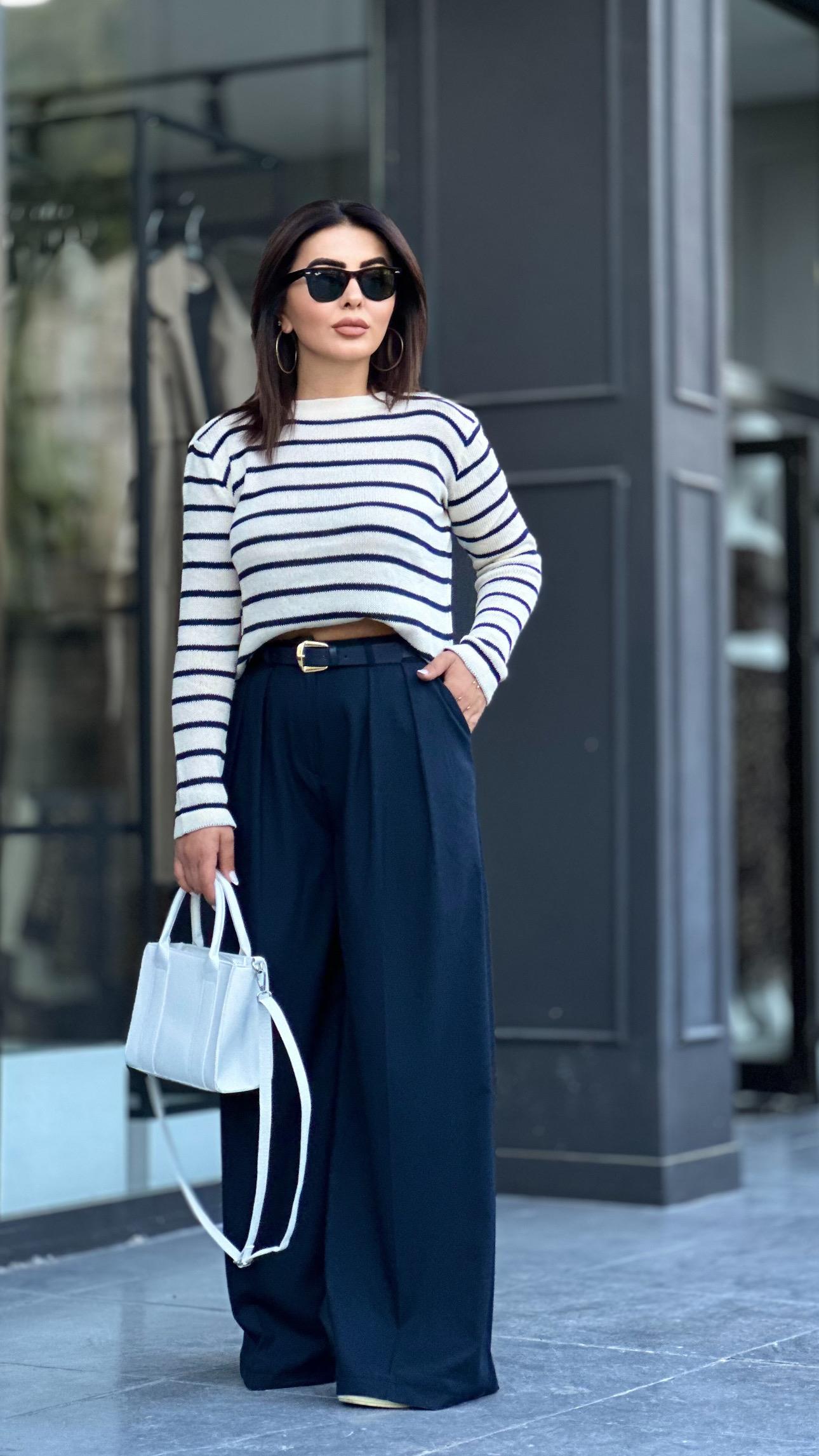 Navy pleated palazzo trousers with built-in belt.