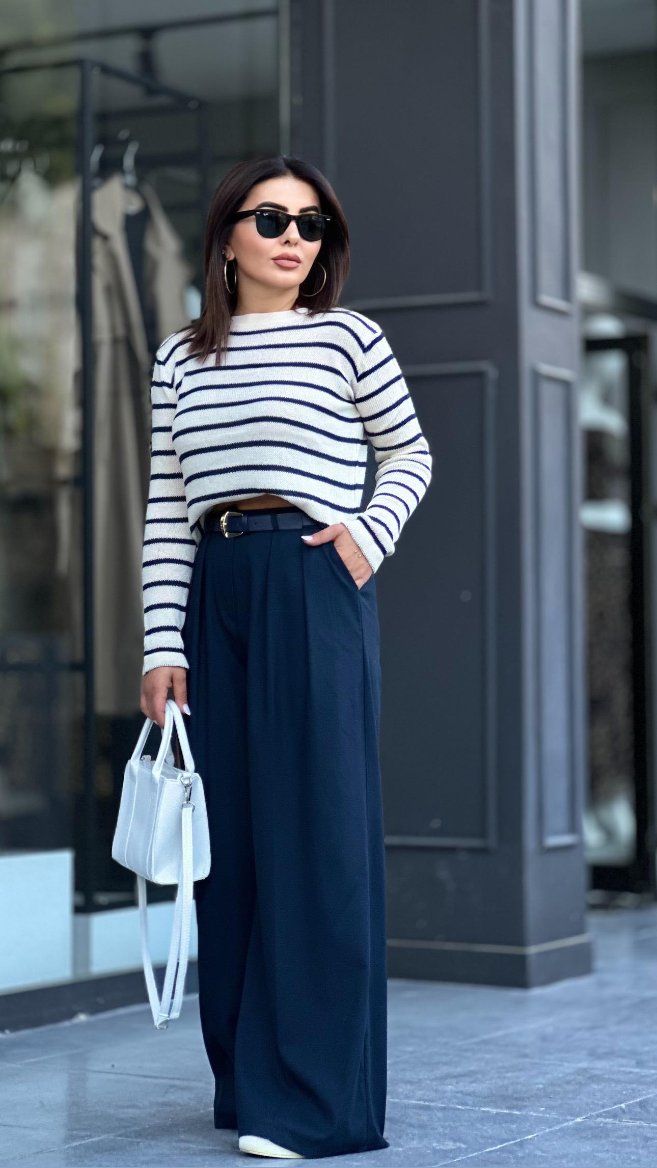 Navy pleated palazzo trousers with built-in belt.