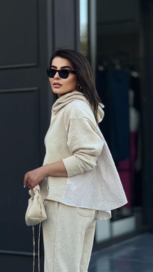 Stone-colored hooded suit with shirt detail.