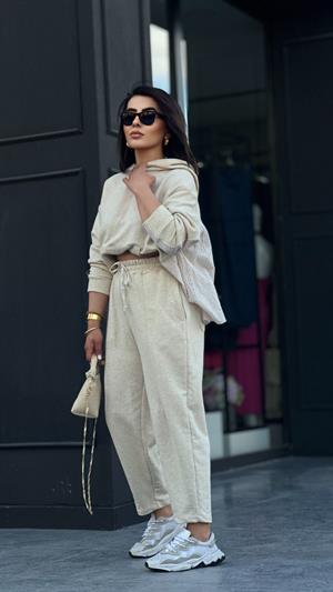 Stone-colored hooded suit with shirt detail.