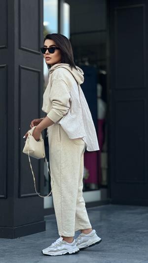 Stone-colored hooded suit with shirt detail.