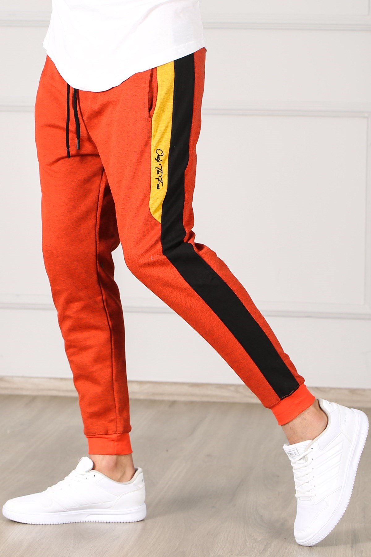 Black joggers with orange stripe hotsell