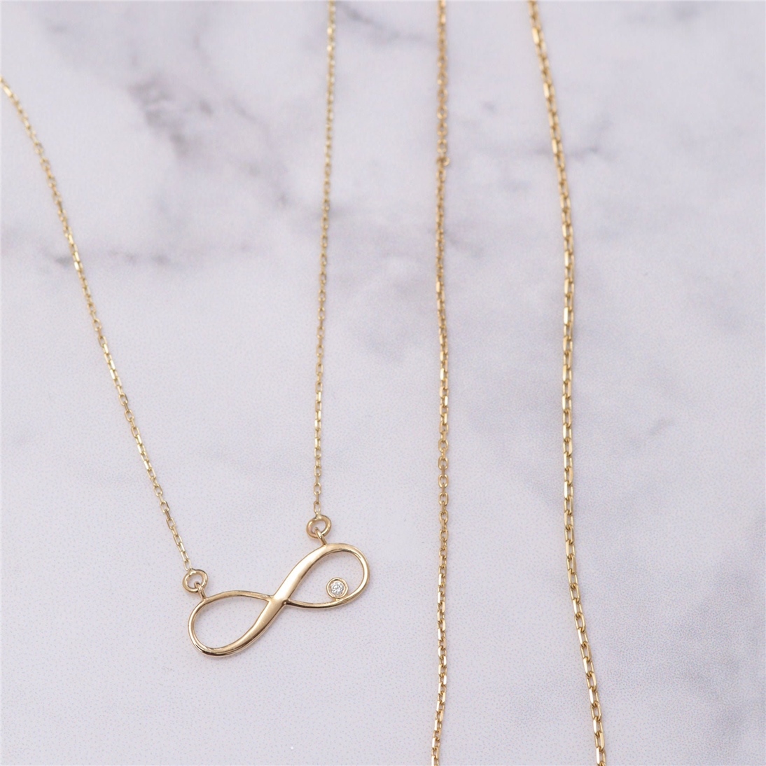 Solid Gold Diamond Infinity Necklace