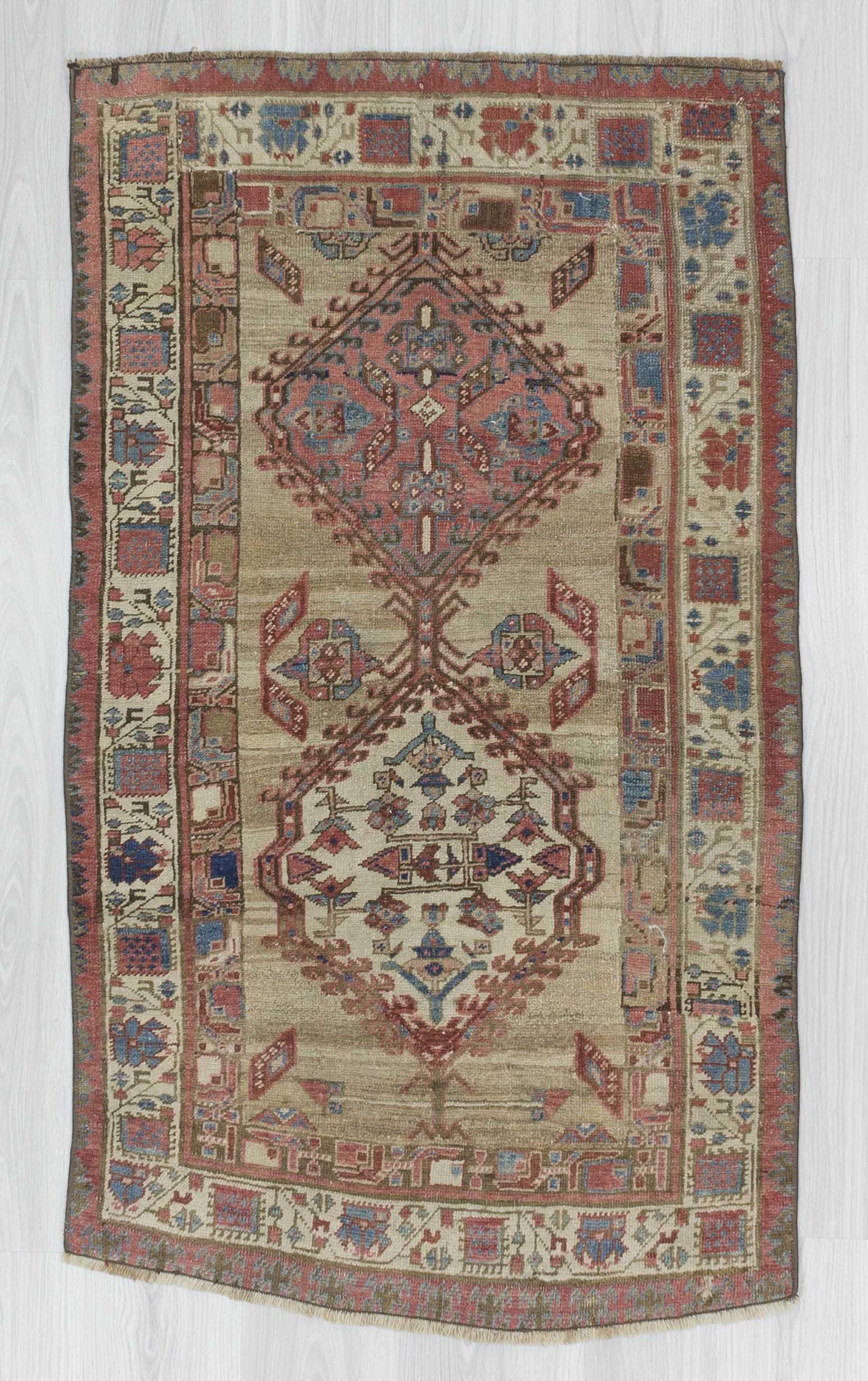 Antique distressed small Persian rug