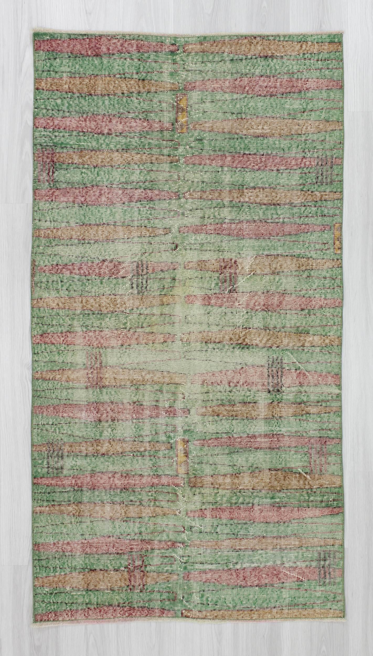 Distressed vintage green ground Turkish art deco rug