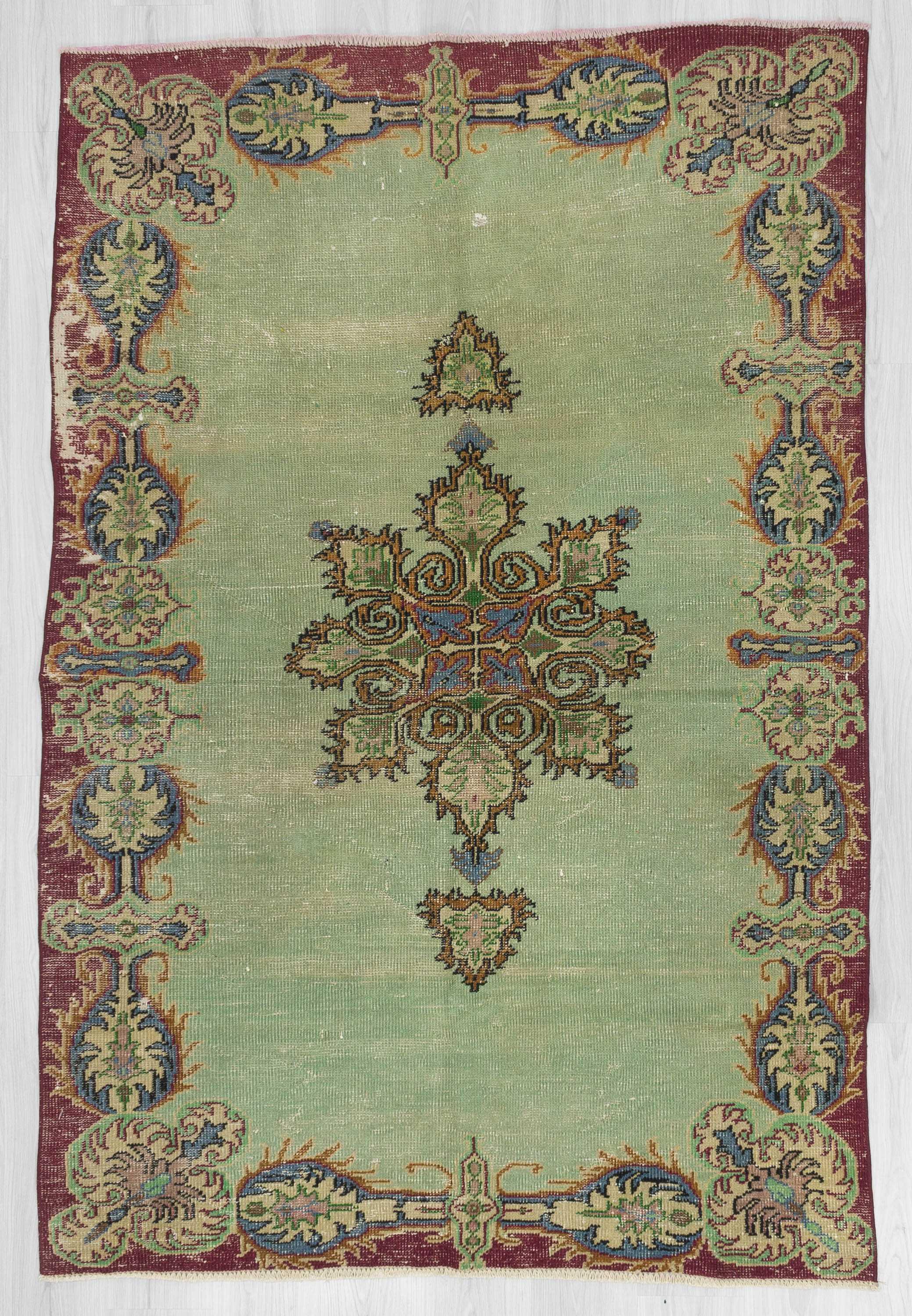 Vintage green distressed Turkish Oushak rug