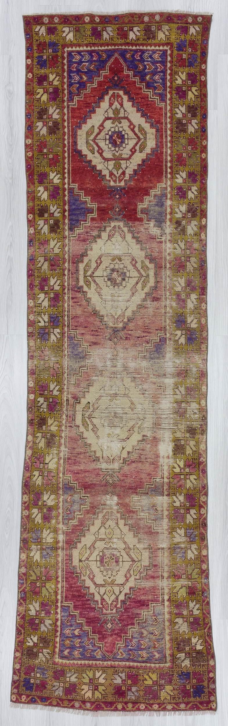 Vintage worn out Turkish runner rug