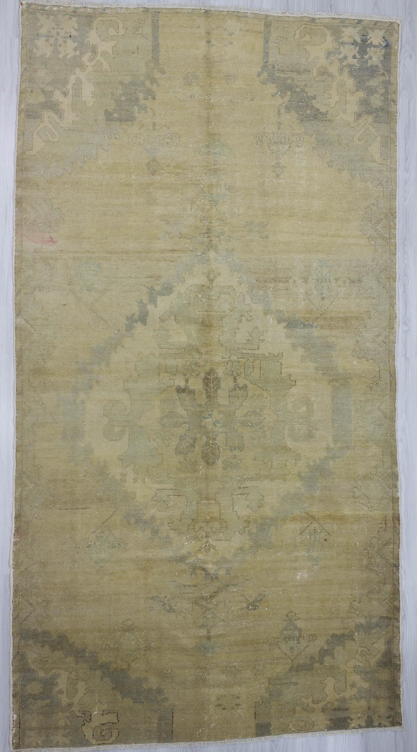 Washed out vintage Turkish Oushak rug