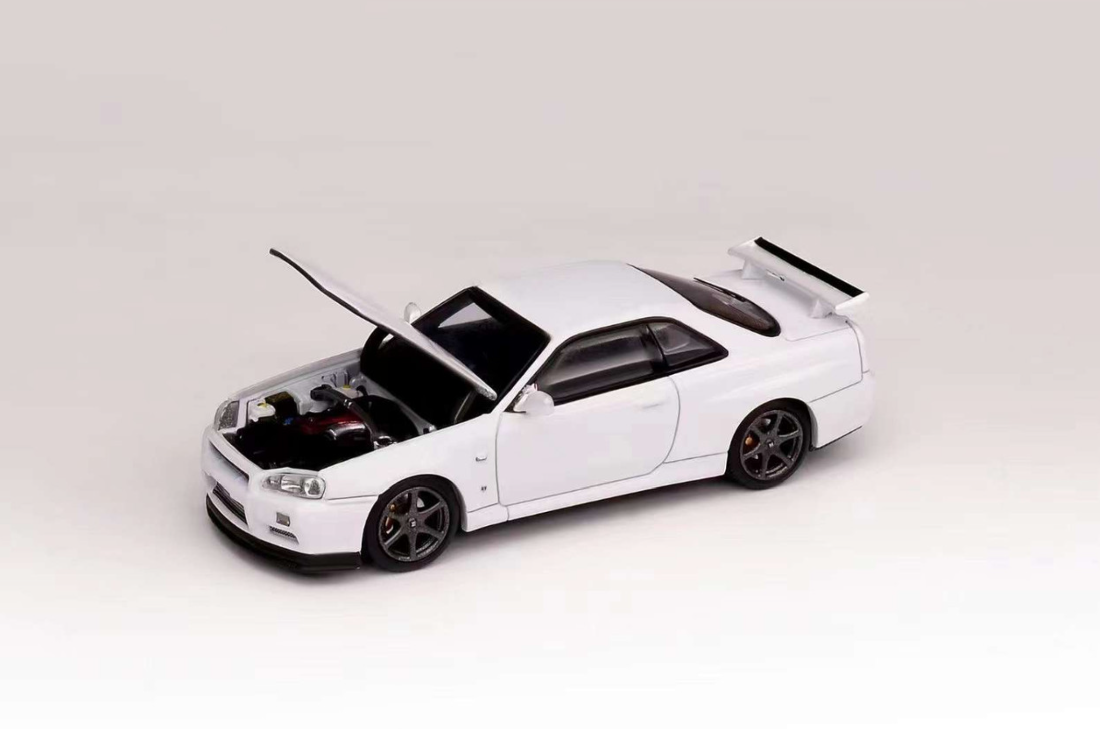 MotorHelix Nissan Skyline GT-R R34 V-Spec II White Pearl