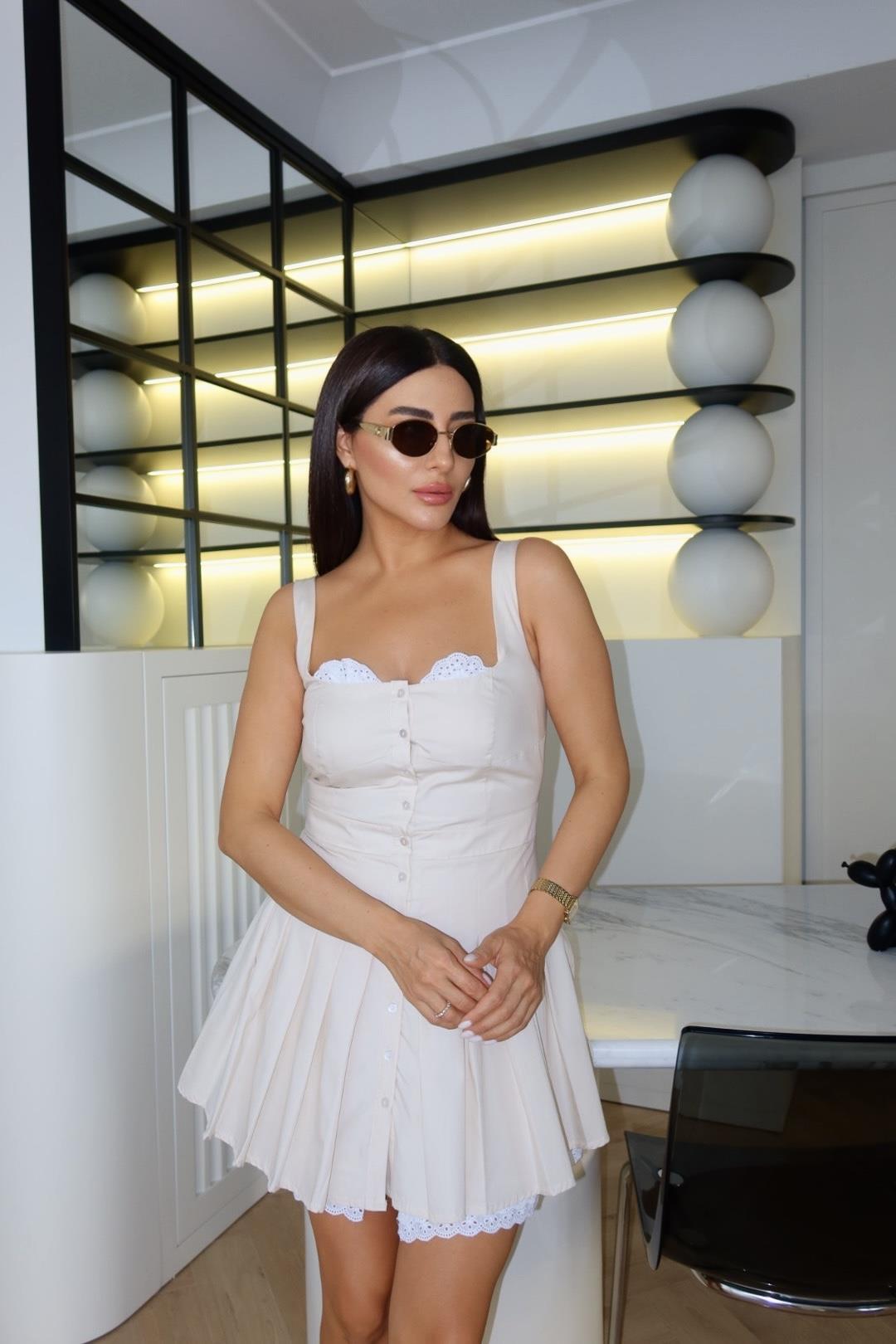 BEJ PİLELİ FİSTO DETAYLI ASKILI ELBİSE