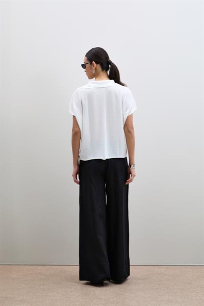 Вязанный свитер с пайетками и воротником-поло