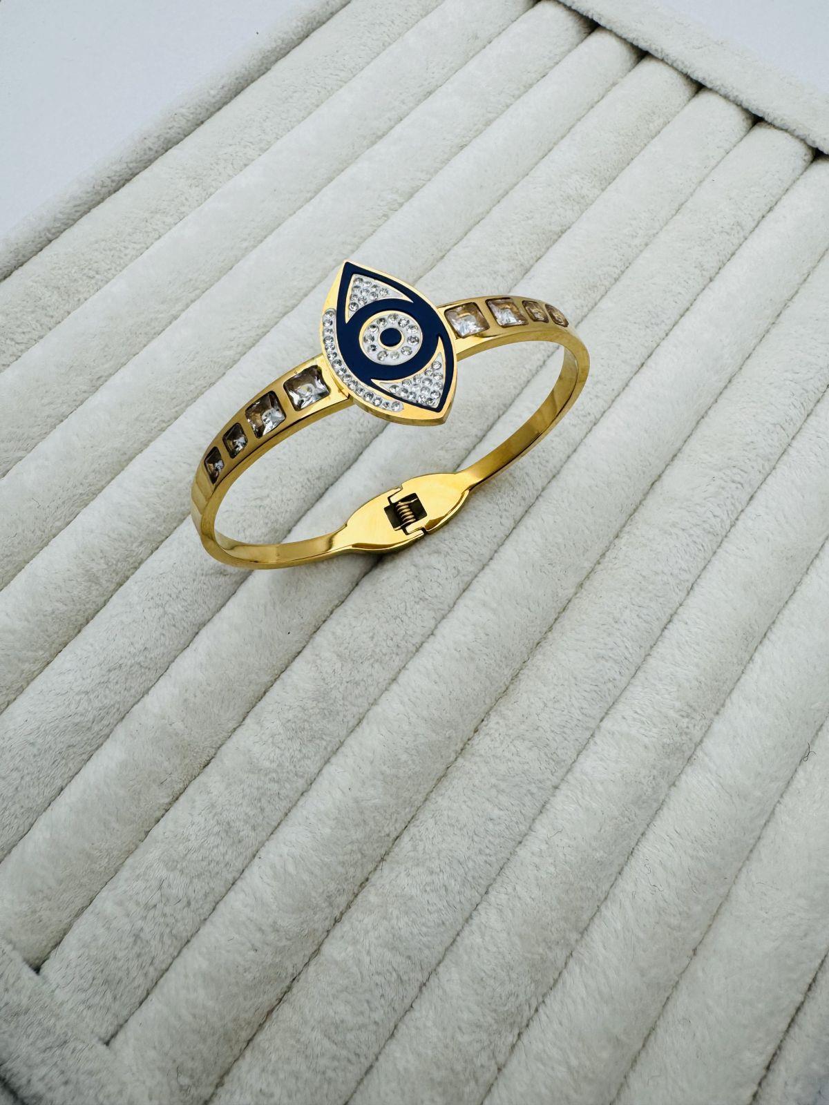 Göz Detaylı Taşlı  Çelik Kelepçe (Gold )2011