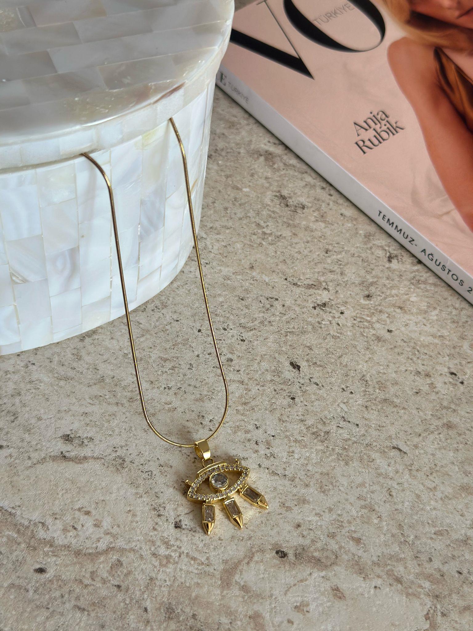 Çelik Gold Kirpikli Göz Kolye