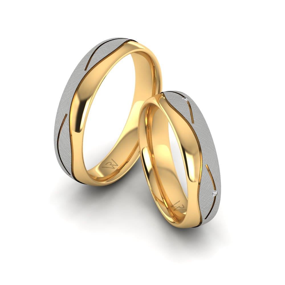 Eheringe mit Devotio-Gelbgold und weißen Dalloz-Kristallsteinen