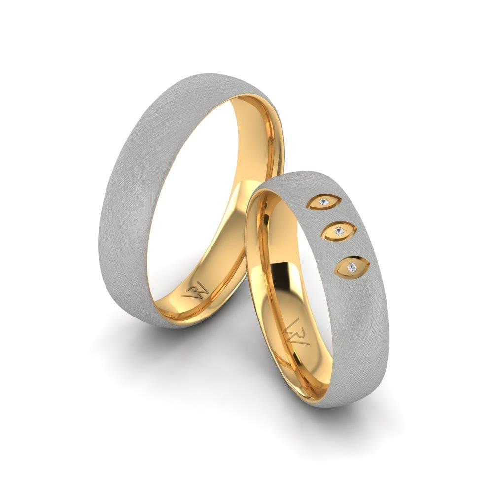 Eheringe mit Glimmera-Gelbgold und weißen Dalloz-Kristallsteinen