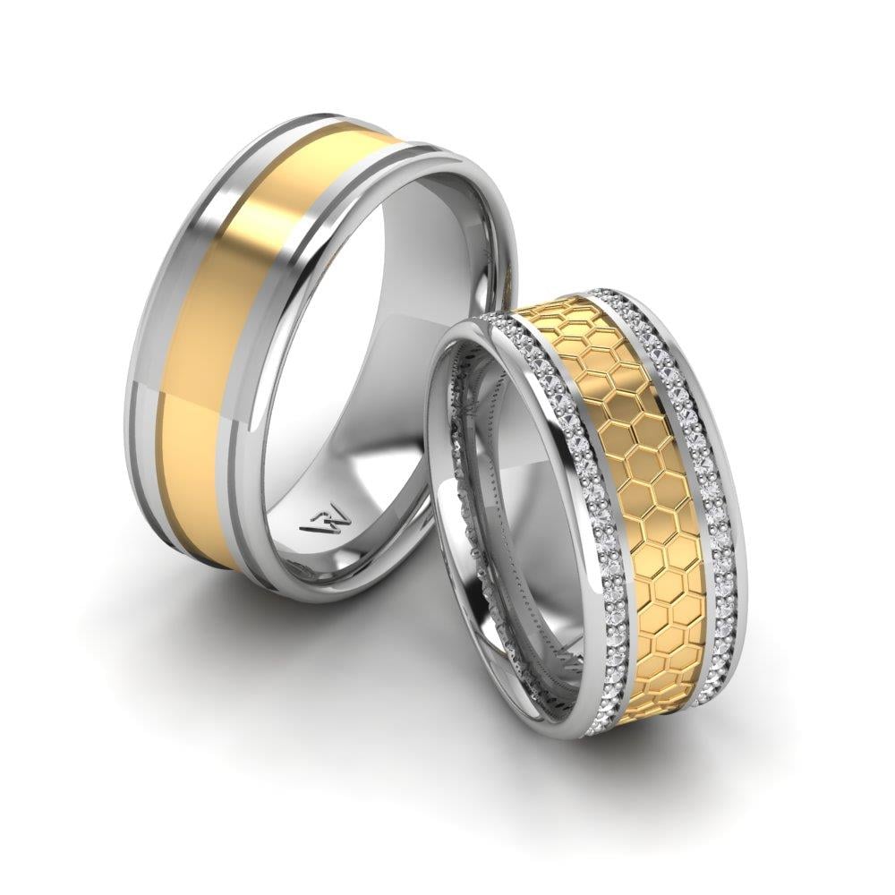 Eheringe mit Blissspin-Steinen aus Weißgold und gelbem Dalloz-Kristall
