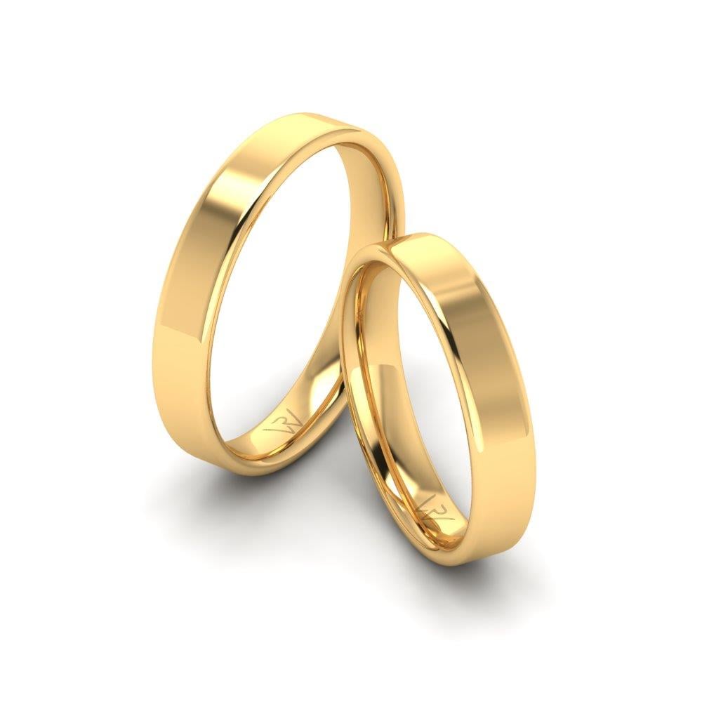 Klassische glitzernde Eheringe aus Gelbgold 