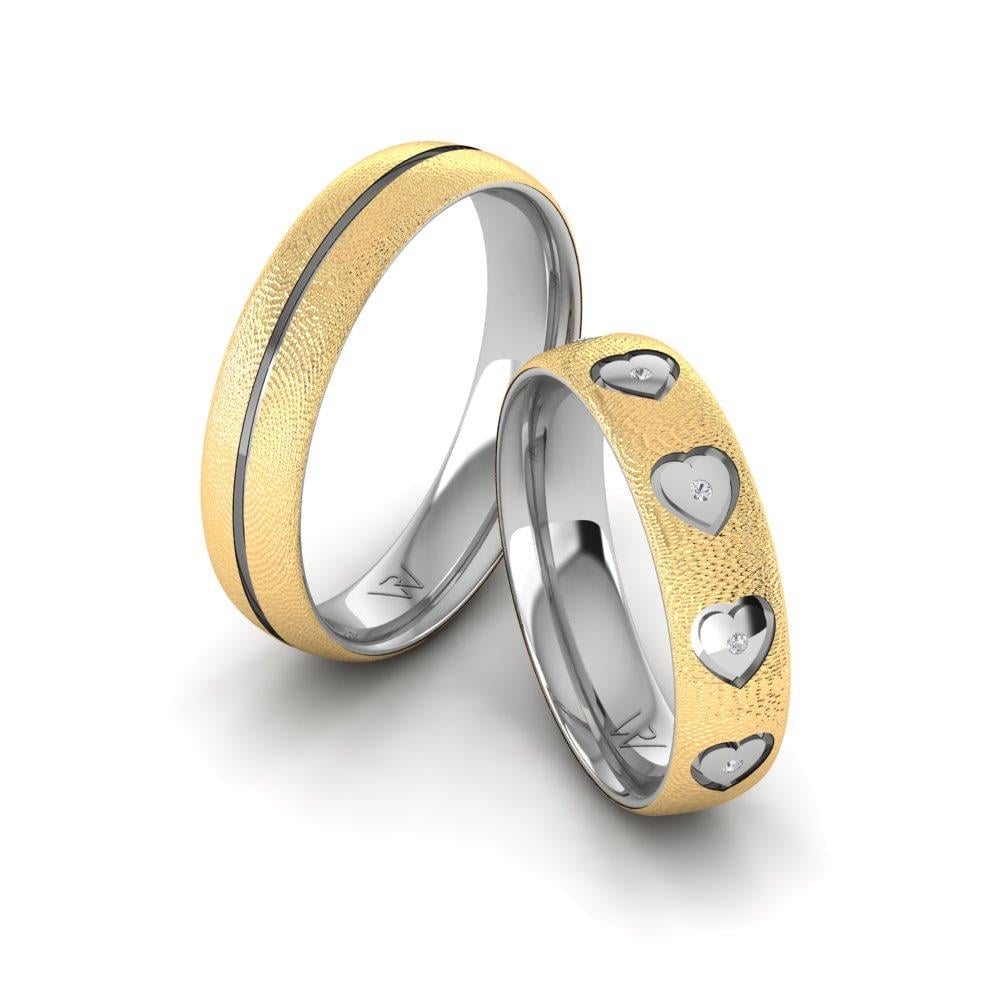 Eheringe mit Steinen von Foreverrings aus Gelbgold und weißem Dalloz-Kristall