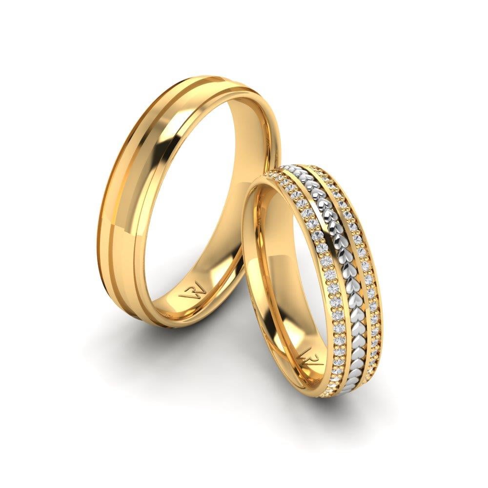 Eheringe mit SerenityLoop-Steinen aus Gelbgold und weißen Dalloz-Kristallen