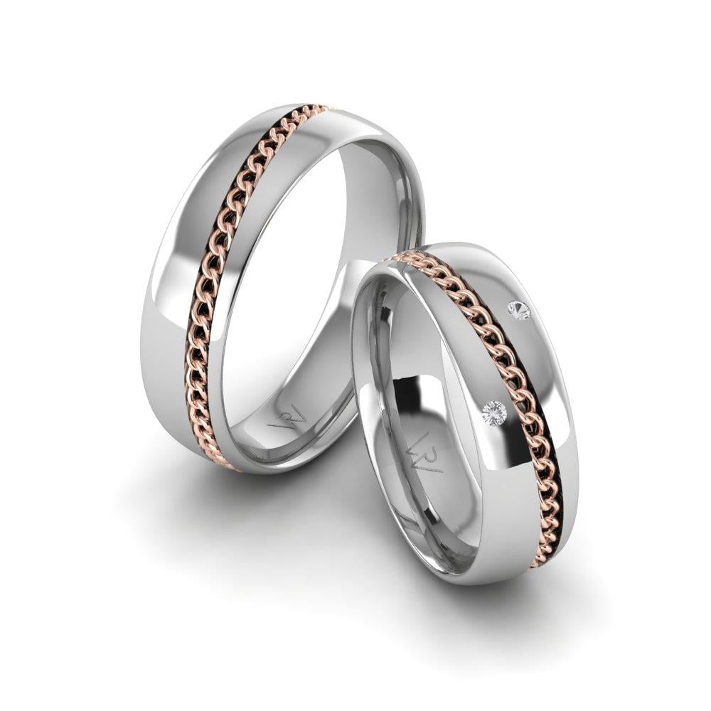 Eheringe mit UnityEssence-Steinen aus Weißgold und rosa Dalloz-Kristallen