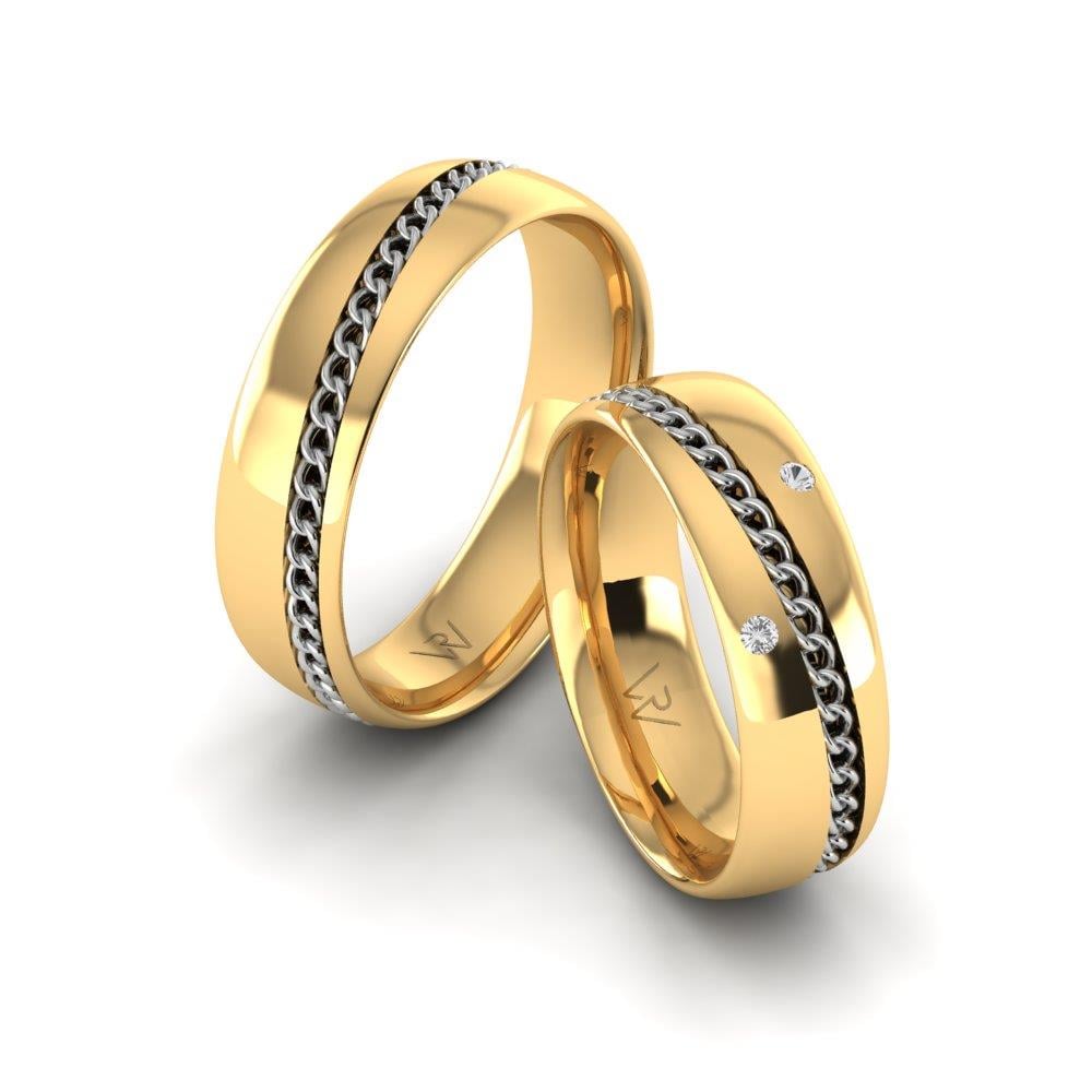 Eheringe mit UnityEssence-Steinen aus Gelbgold und weißen Dalloz-Kristallen