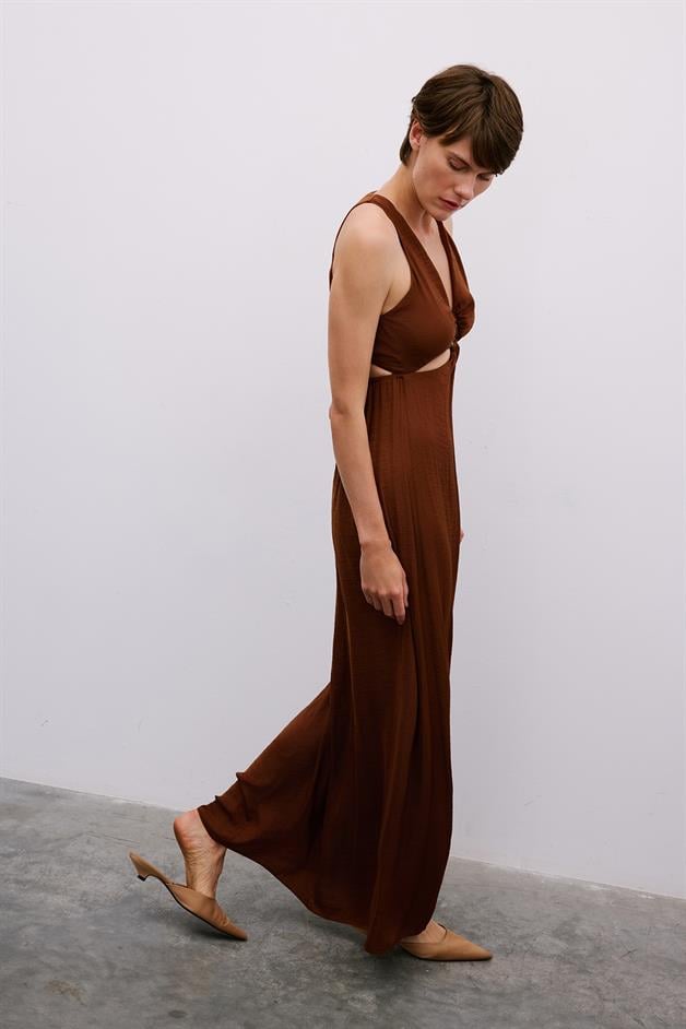 Long Brown Cut-Out Dress with Gold Accessories