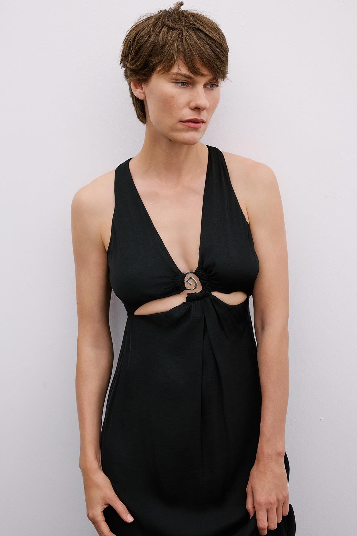 Long Black Cut-Out Dress with Gold Accessories