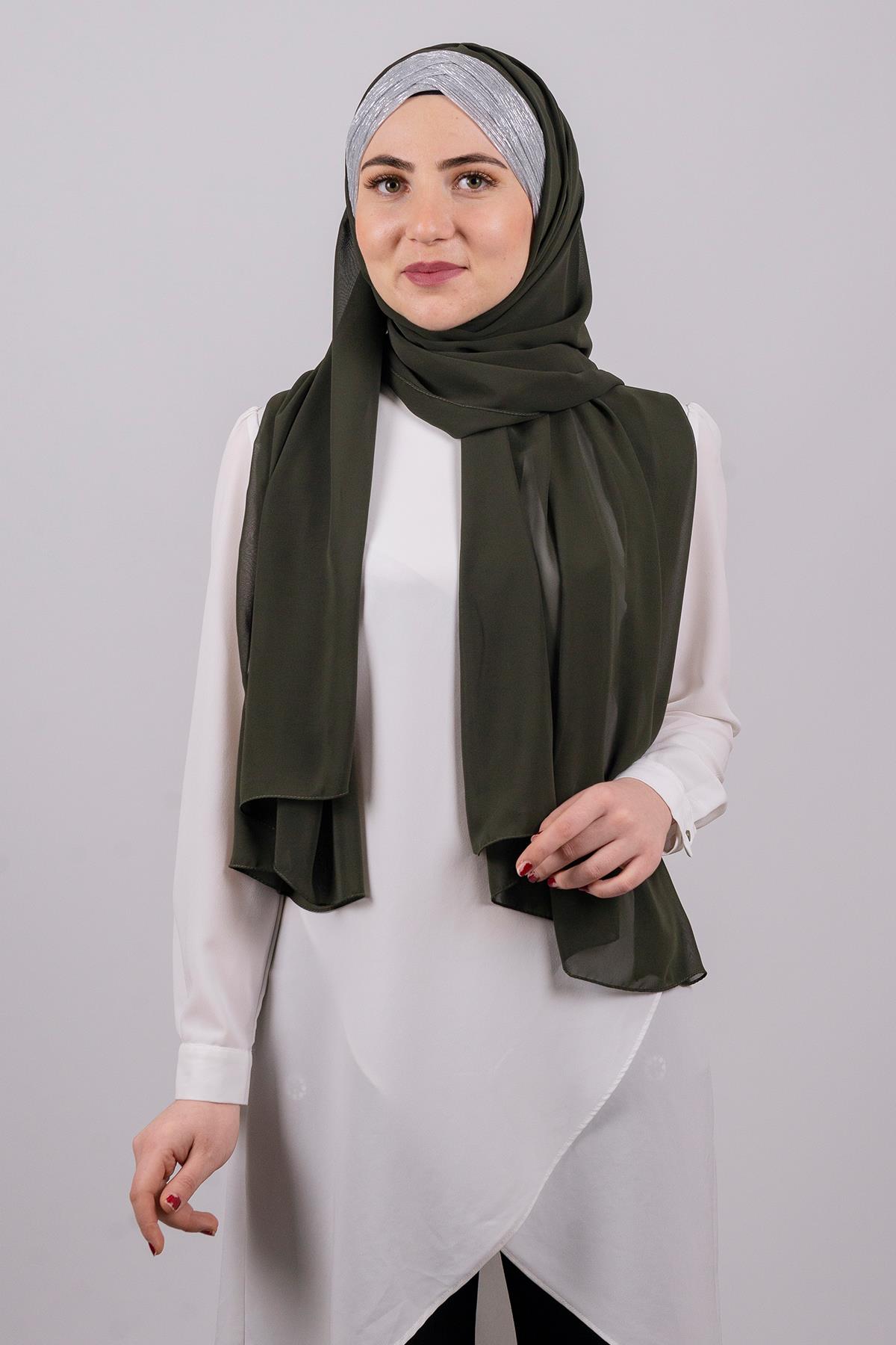 shawl tied behind back