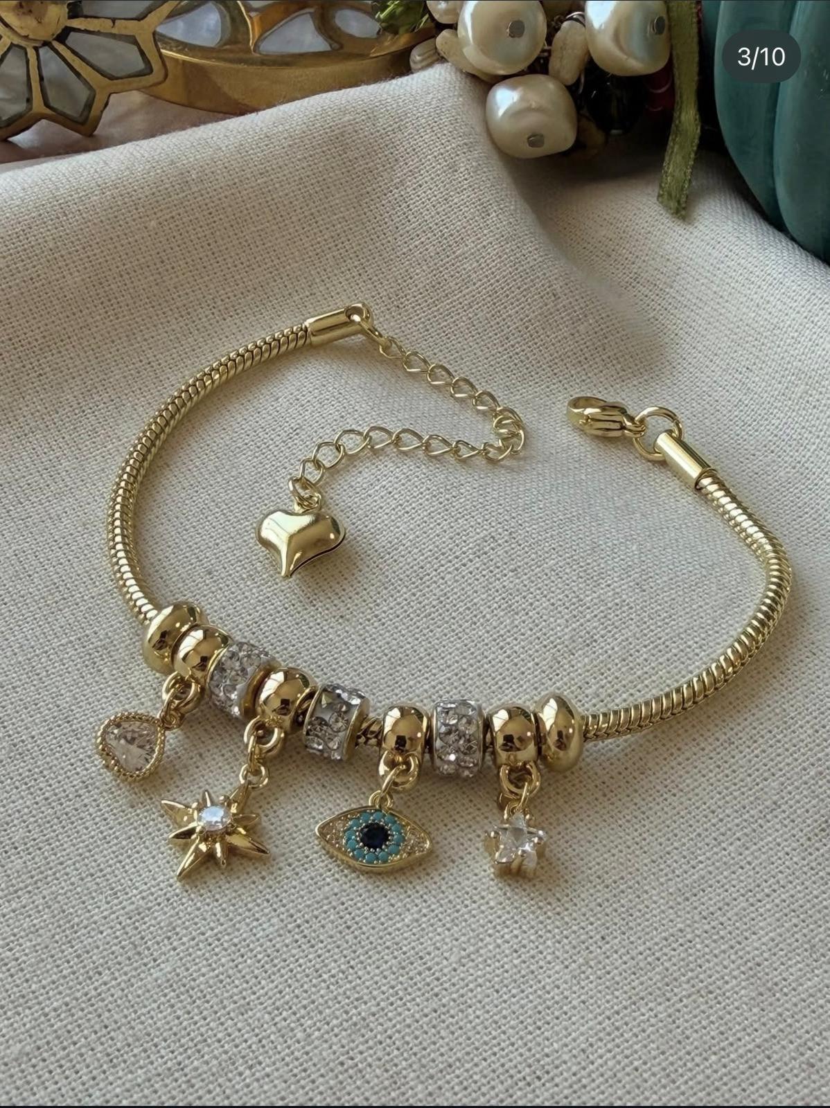 VİP SERİ NAZAR GÖZ MODEL KUTUP YILDIZI DETAYLI GOLD CHARM BİLEKLİK
