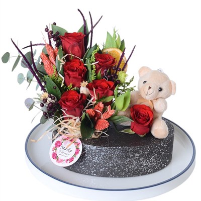 Red Roses in a Boat-Patterned Pot