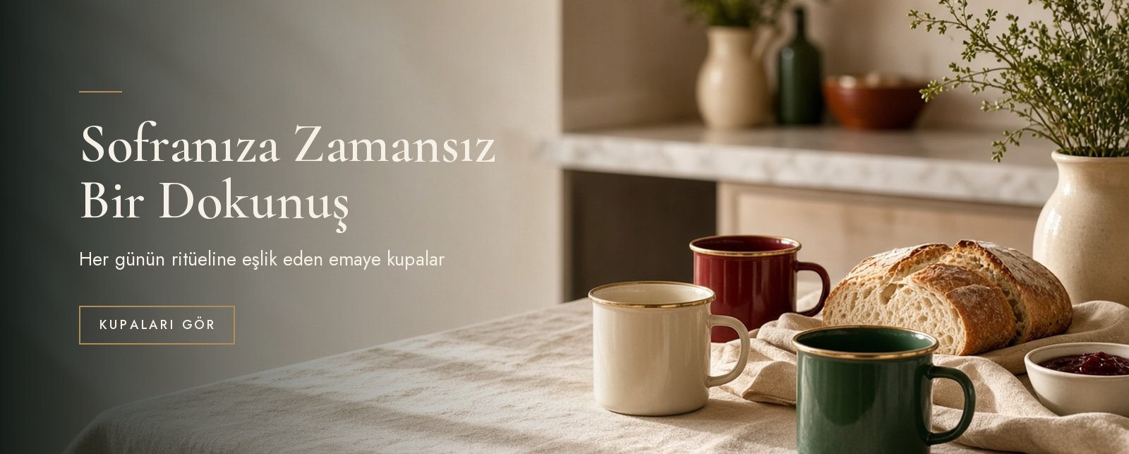 Breakfast table with enamel mugs in a cream kitchen
