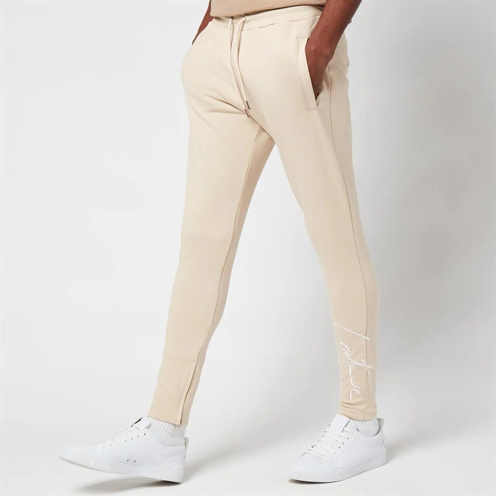 Paçaları İmza Nakışlı Slim   Eşofman Altı Jogger Krem