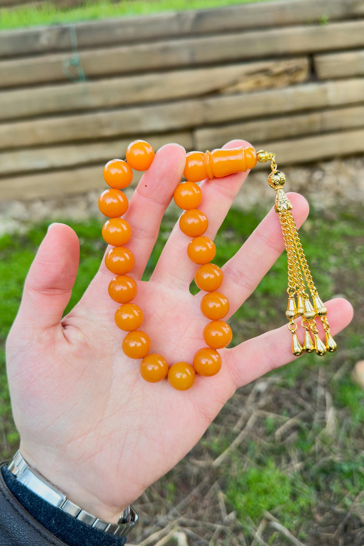 Küre Tane Turuncu Gold Püsküllü 17lik Sıkma Kehribar Tesbih