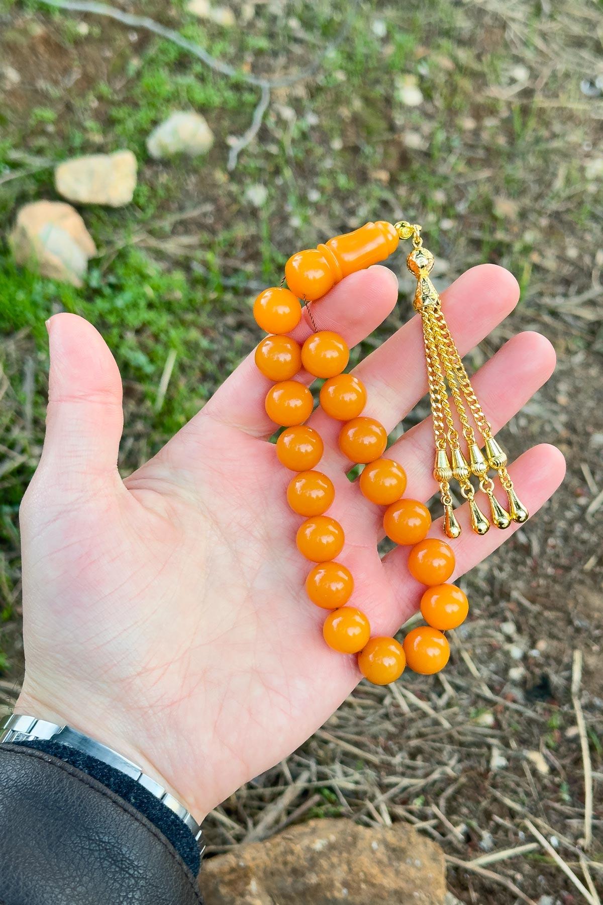 Küre Tane Turuncu Gold Püsküllü 17lik Sıkma Kehribar Tesbih