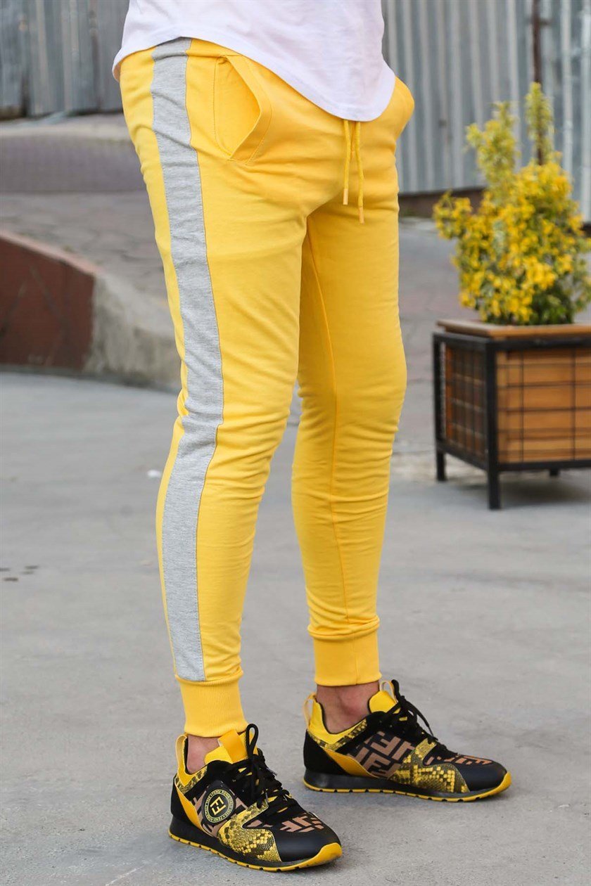 Yellow joggers with black stripe sale