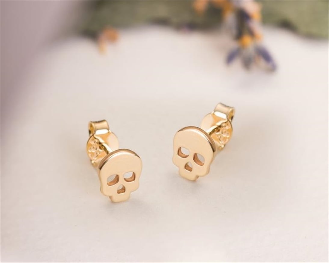 Gold skull on sale earrings