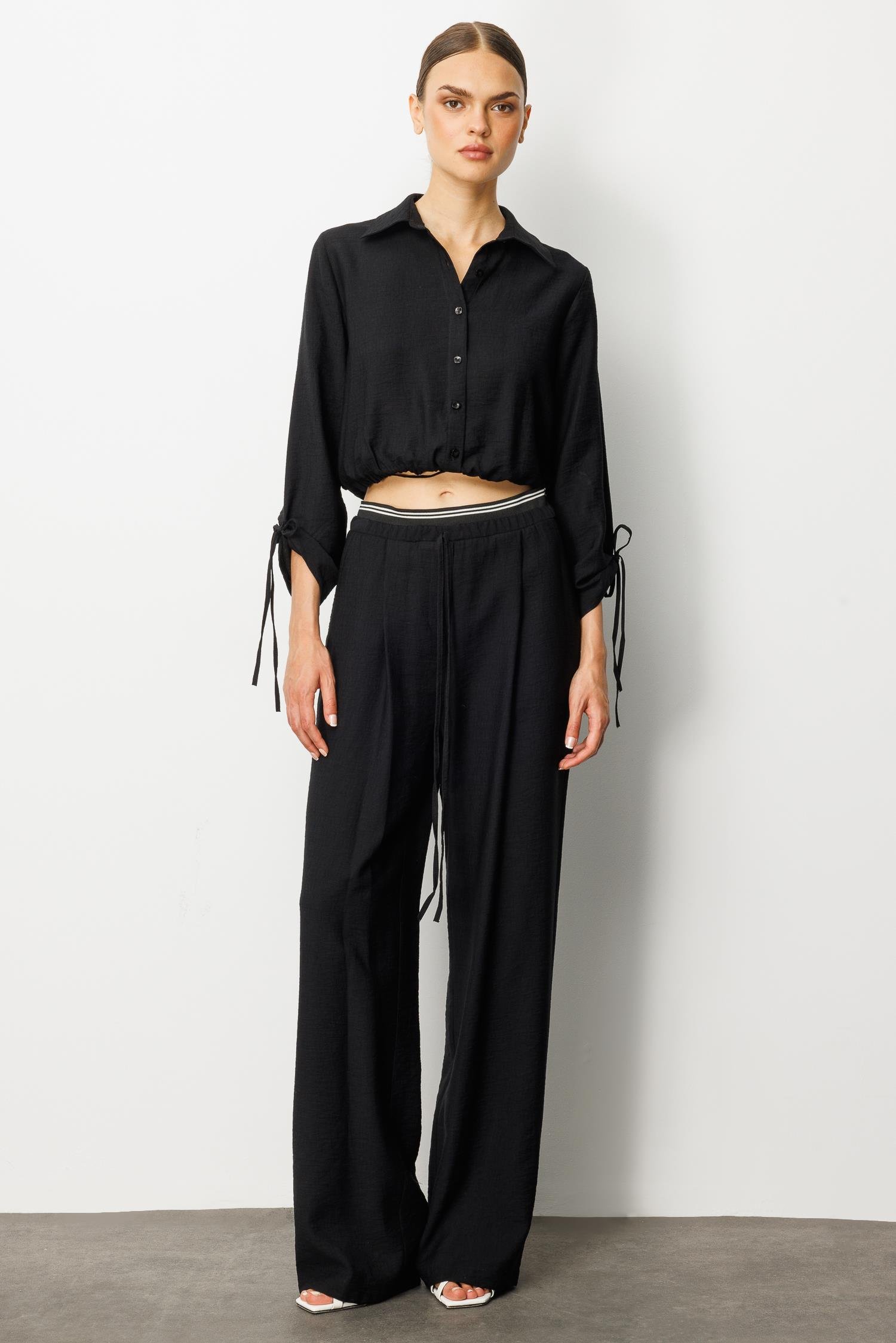 Modailgi  Beli Lastik ve Ribana Detaylı Bol Paça Pileli Yandan Cepli Yüksek Bel Pantolon - 10037 Siyah