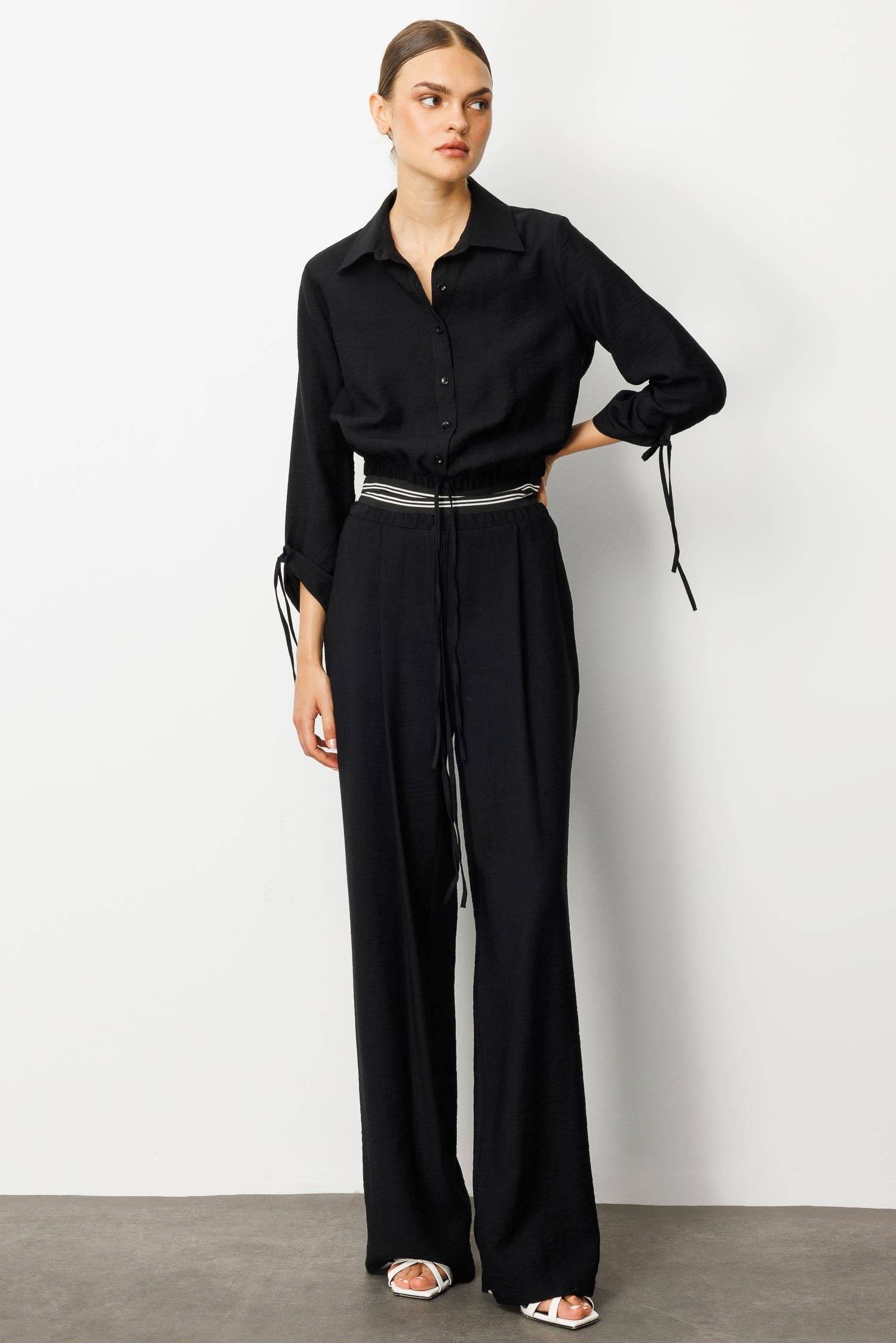 Modailgi  Beli Lastik ve Ribana Detaylı Bol Paça Pileli Yandan Cepli Yüksek Bel Pantolon - 10037 Siyah