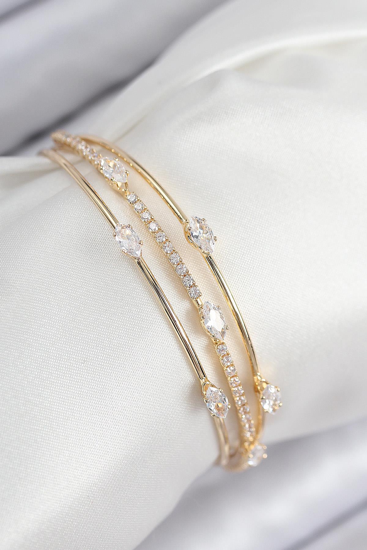 Pirinç Zirkon Taşlı Su Yolu Model Gold Renk Kadın Bileklik