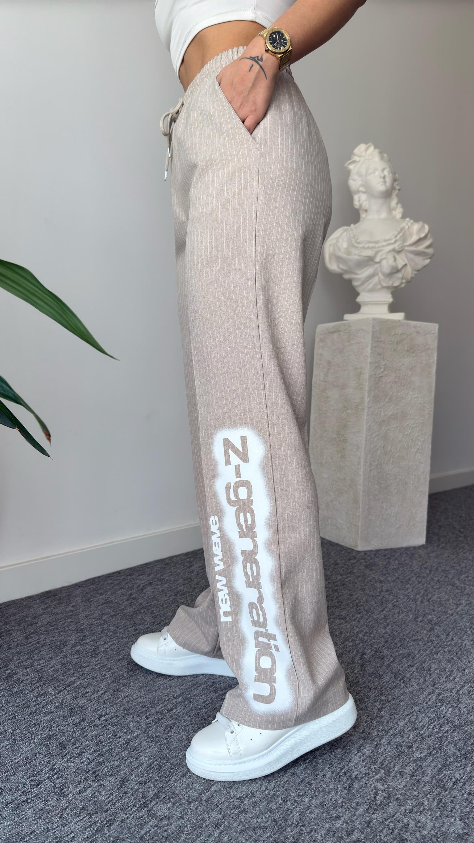 Paça Detaylı Çizgili Bej Palazzo Pantolon