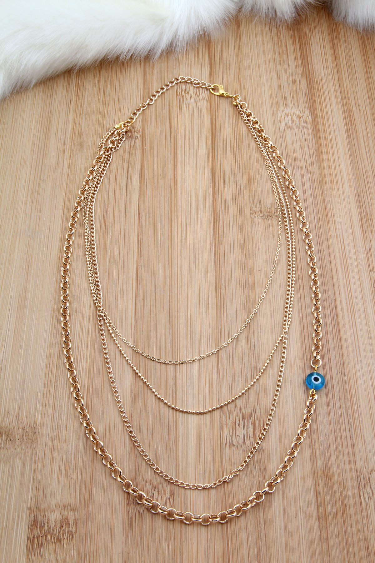 4 Sıralı Nazar Boncuklu Gold Renk Zincir Kolye