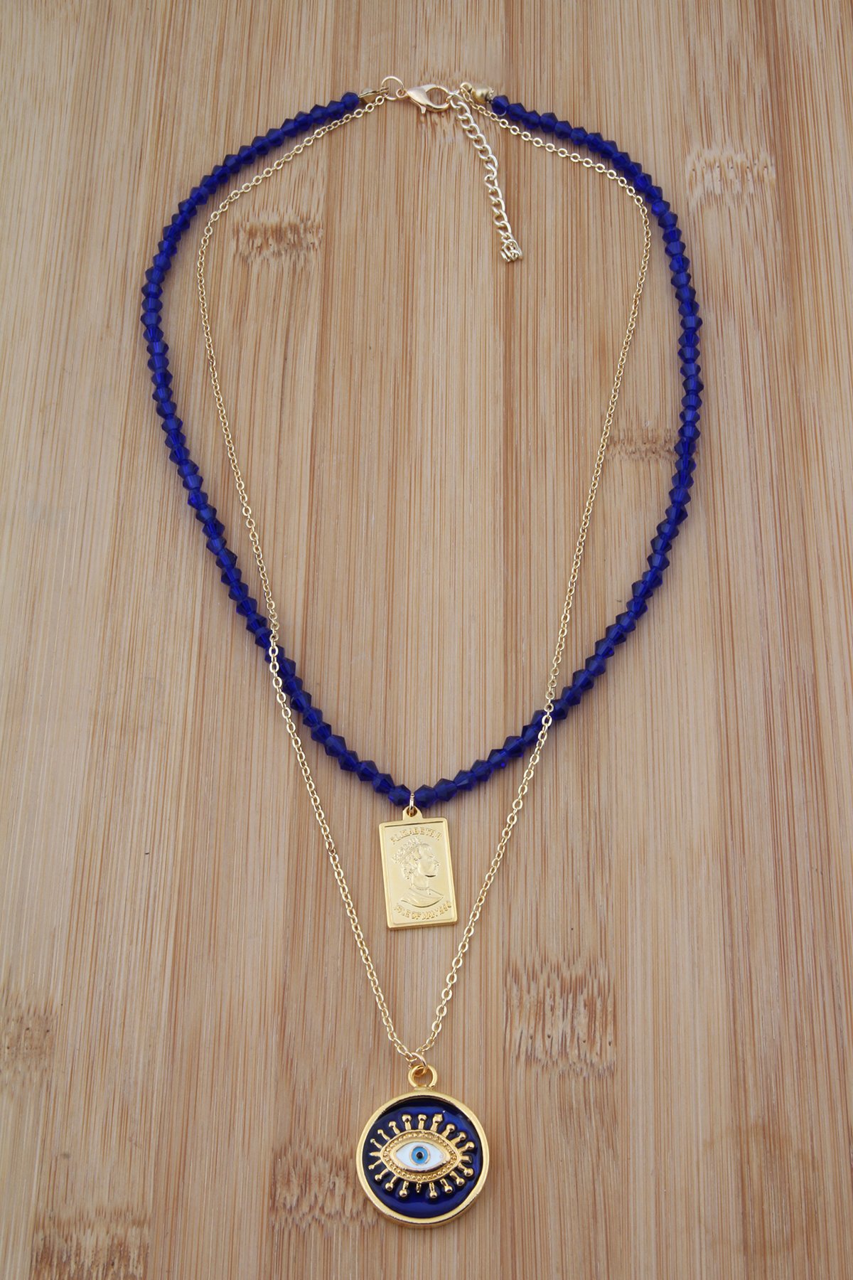Lacivert Kristalli Madalyon ve Göz Figürlü Kolye