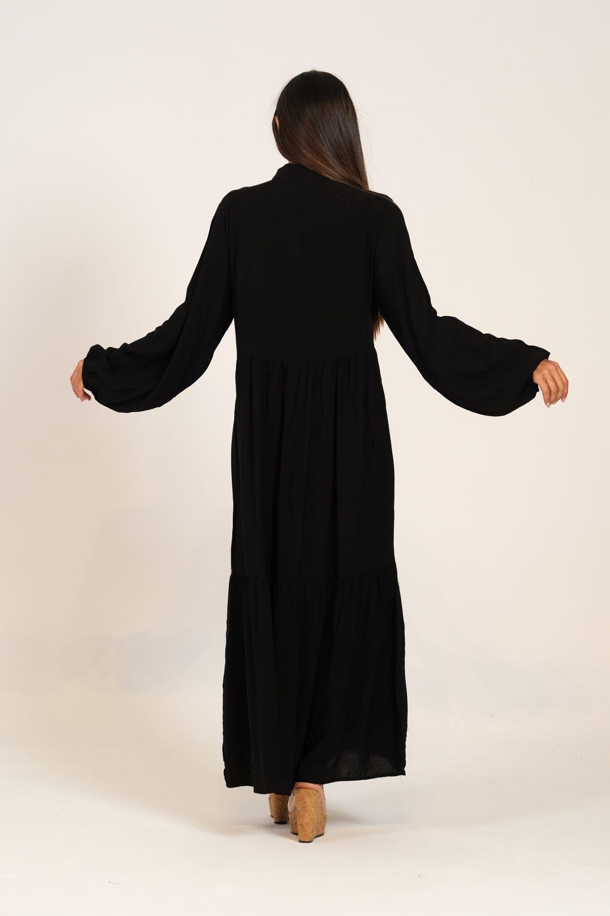 Siyah Balon Kollu Önü Yonca Nakışlı Püsküllü Eteği Kat Kat Uzun Elbise