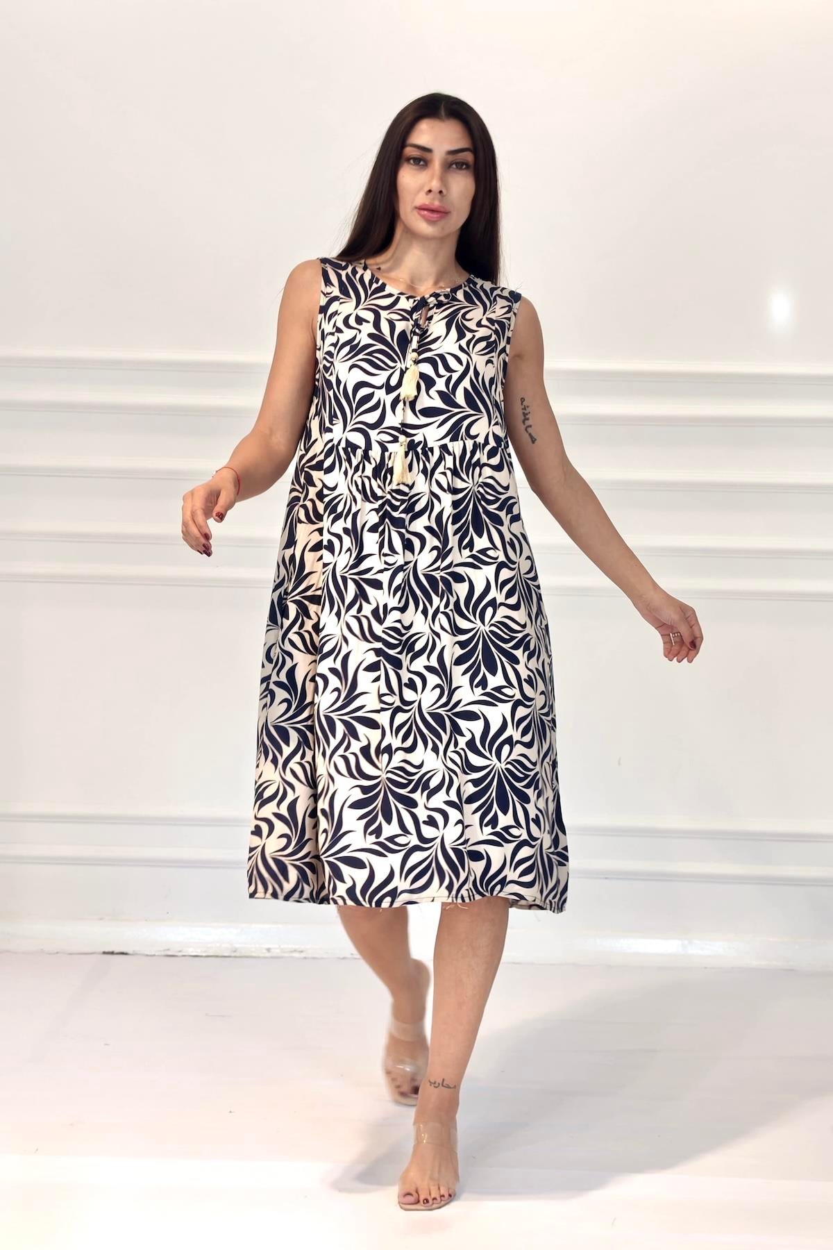 Siyah Desenli Kolsuz Boncuk Detaylı Cepli Midi Elbise