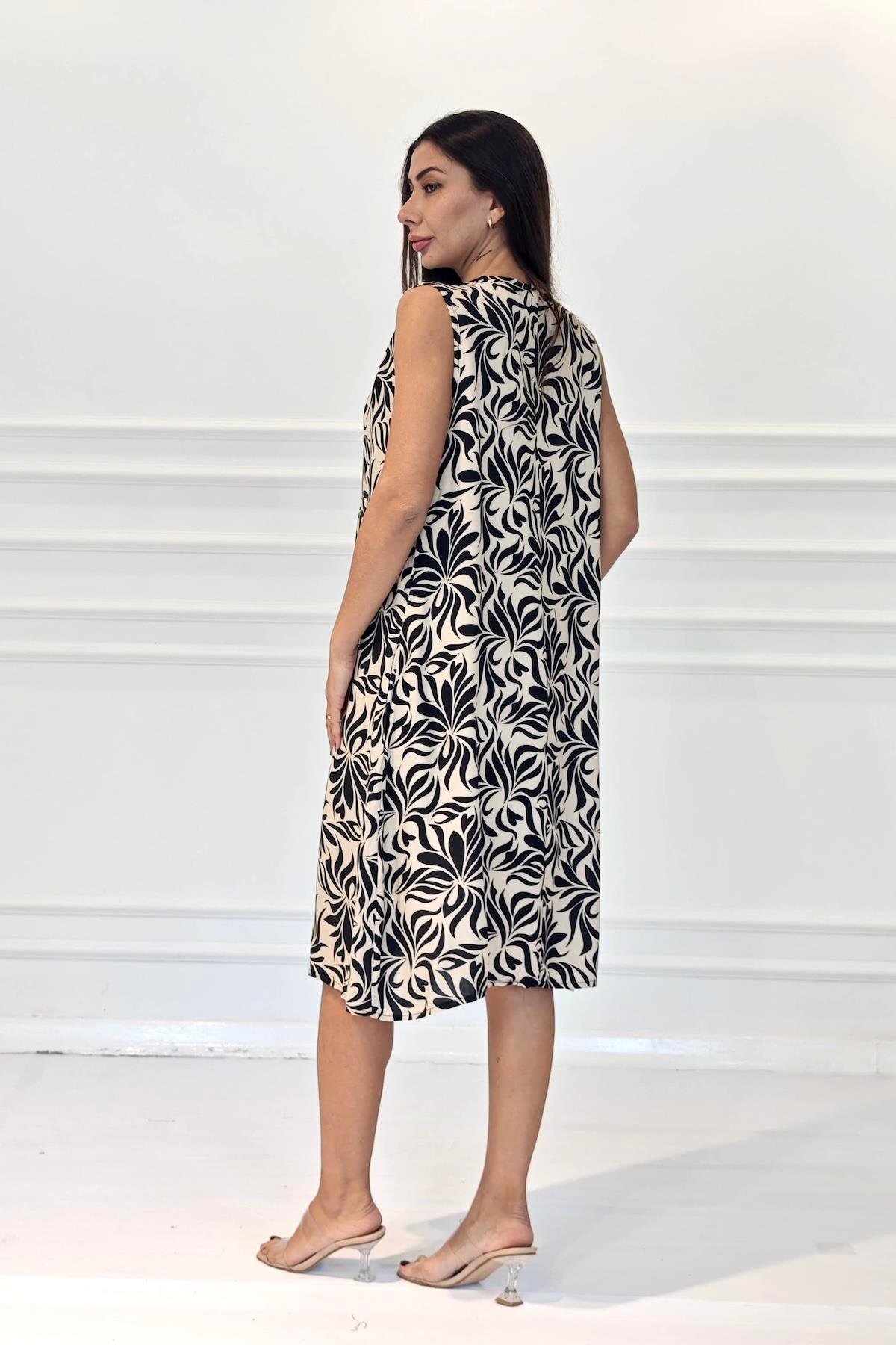 Siyah Desenli Kolsuz Boncuk Detaylı Cepli Midi Elbise